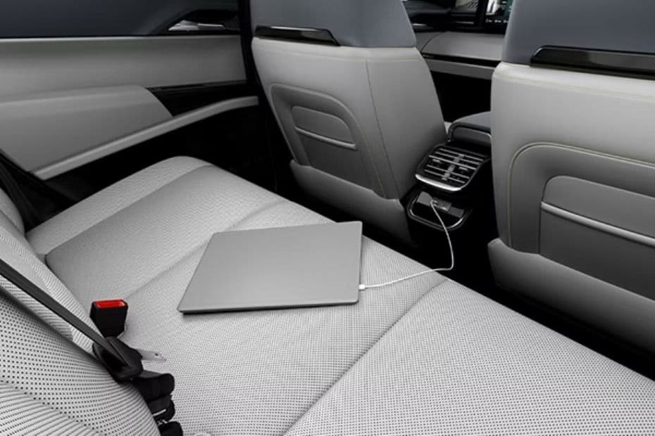 Rear cabin USB charging port connected to a passenger device