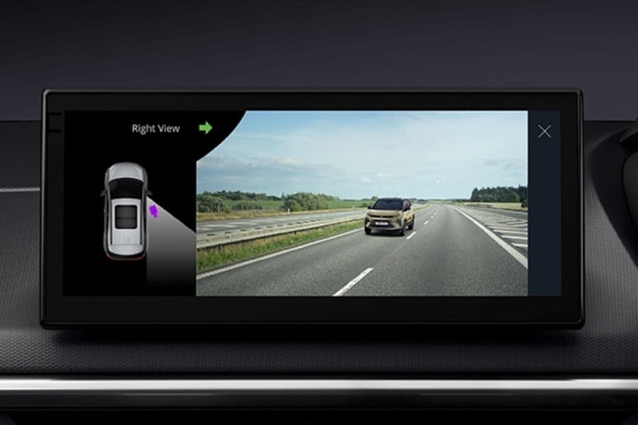 Display showing the vehicle surroundings through the blind view monitoring system