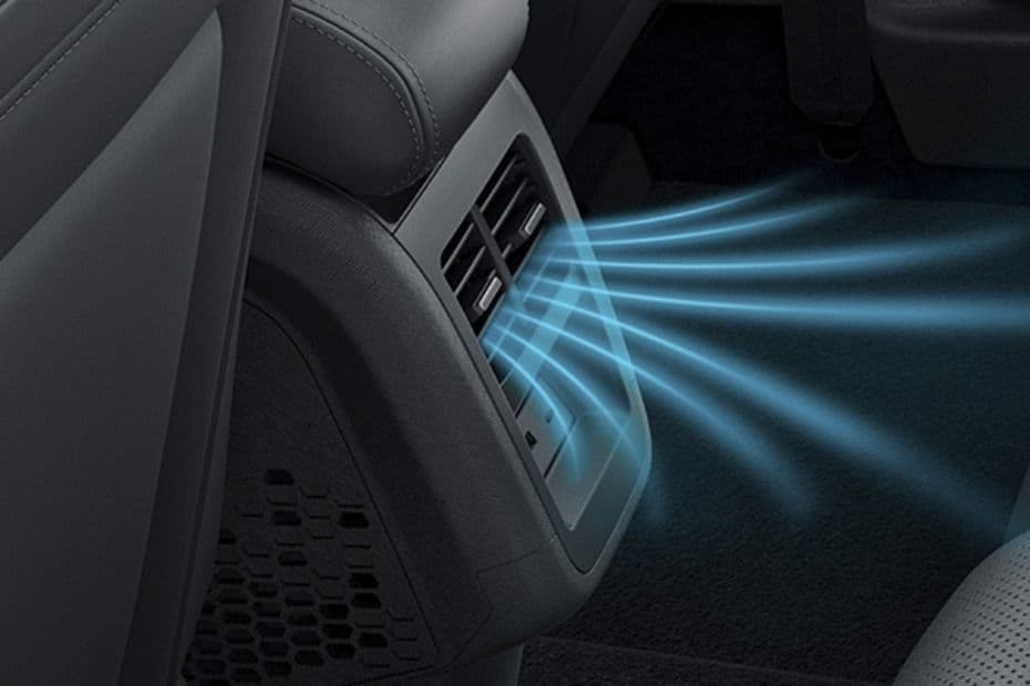 Rear AC vents directing cool air toward the rear passengers
